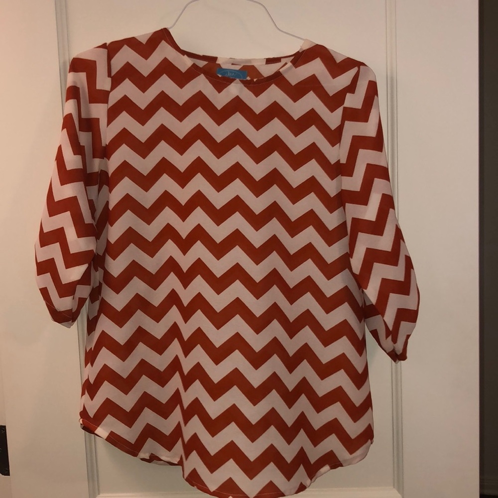 Burnt orange chevron top!